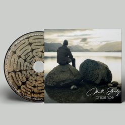 Presence CD - Album cover shows a man sat on a rock looking across a beautiful lake with a sunset.